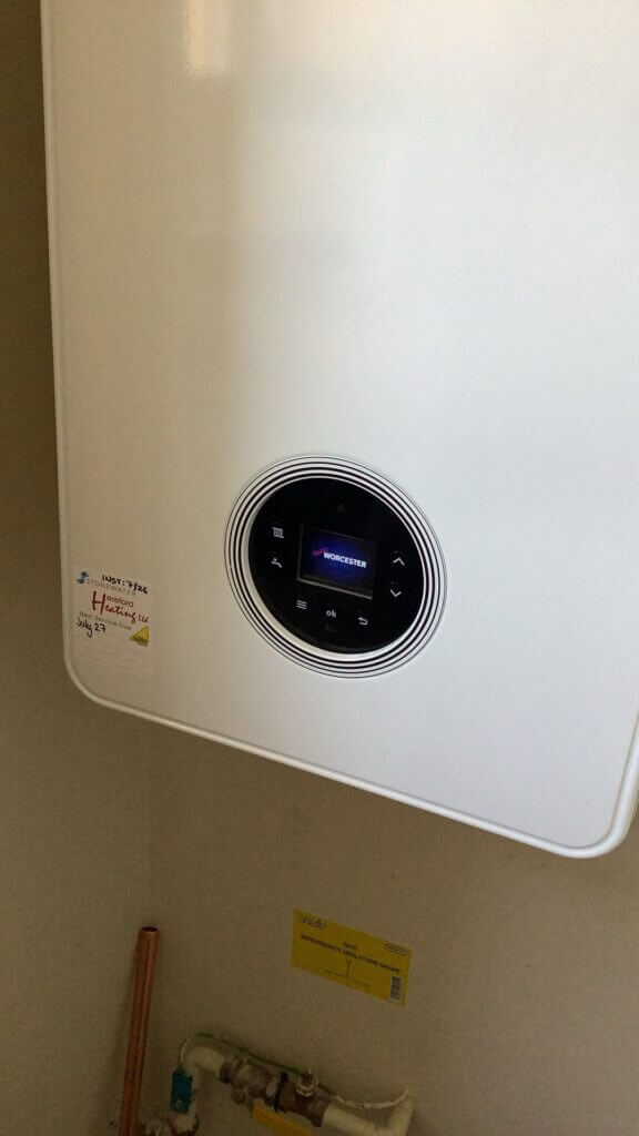 Close-up view of a modern Worcester Bosch boiler digital display panel and controls